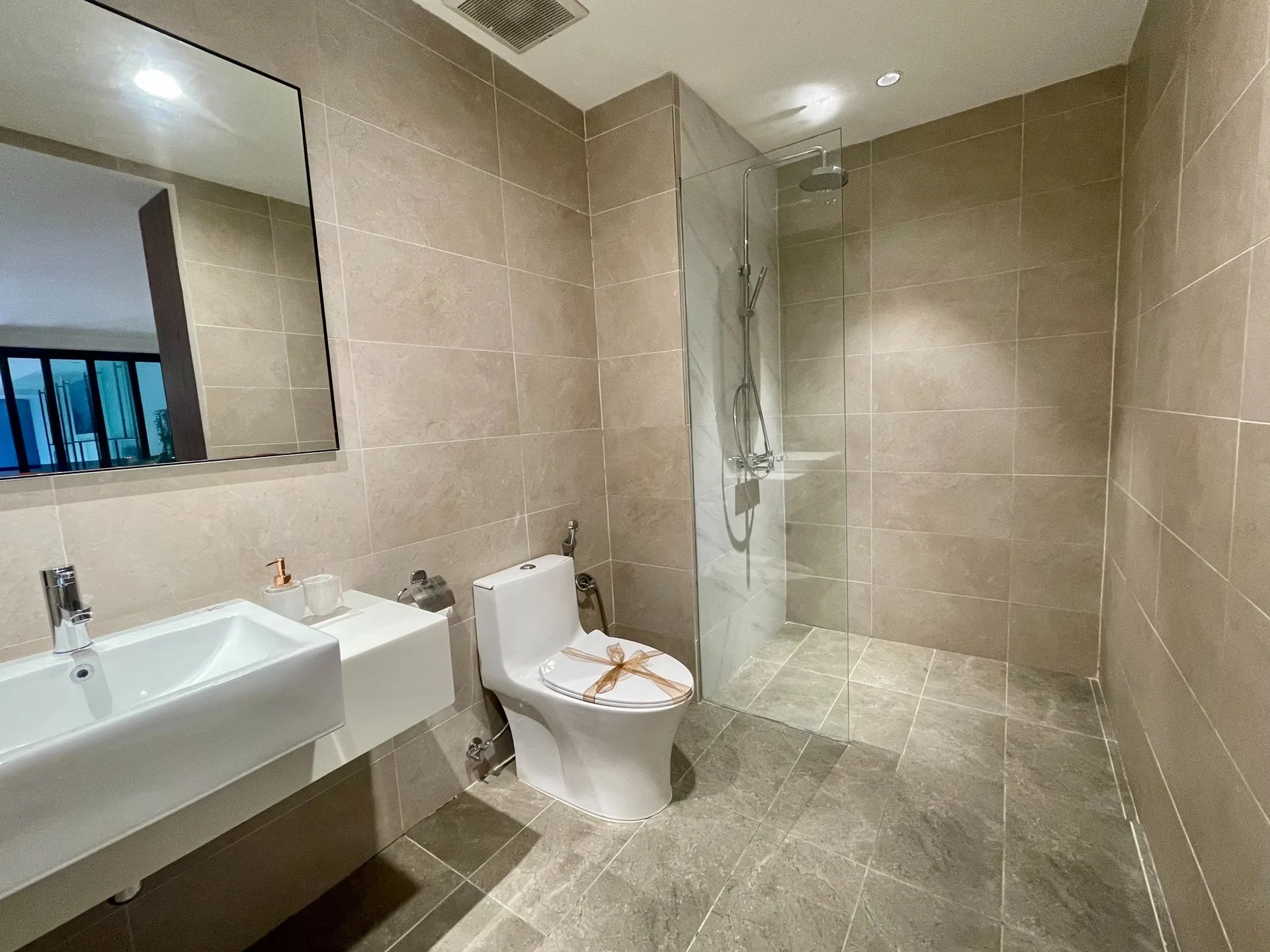 Humidity-resistant bathroom remodel in Port St Lucie with porcelain tile and quartz vanity top
